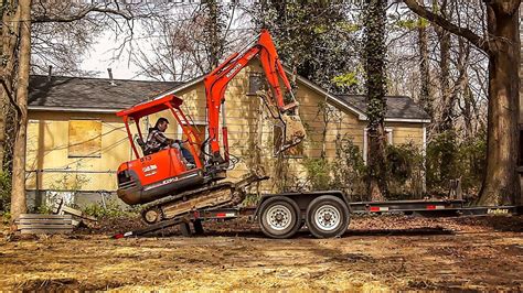 how to strap a mini excavator to a trailer|how to load mini excavators.